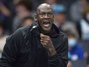 FILE - Michael Jordan looks on during the first half of an NBA basketball game between the Charlotte Hornets and the New York Knicks in Charlotte, N.C., Friday, Nov. 12, 2021. Michael Jordan is finalizing a deal to sell the majority share of the Charlotte Hornets, a move that will end his 13-year run overseeing the organization, the team announced Friday, June 16, 2023. Jordan is selling to a group led by Gabe Plotkin and Rick Schnall, the Hornets said.