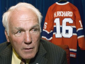 FILE - Montreal Canadiens' Henri Richard responds to questions in Ottawa, June 1, 2007. Richard's family says the Hockey Hall of Famer has been diagnosed with chronic traumatic encephalopathy, the degenerative brain disease linked to concussions. Richard, who died in 2020 at the age of 84, was diagnosed with Stage 3 CTE – the second-most severe classification -- by Dr. Stephen Saikali at Université Laval in Québec City.