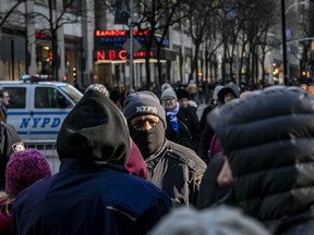 FILE - NYPD officers patrol the surrounding areas at Rockefeller Center in New York on Dec. 19, 2019. A court-appointed federal monitor reported Monday, June 5, 2023, that New York City's reliance on the tactic known as "stop and frisk" as part of a new initiative to combat gun violence is harming communities of color and running afoul of the law.
