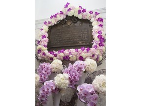 FILE -Flowers adorn the renovated Isidor and Ida Straus memorial plaque as Macy's and the Straus Historical Society celebrate its rededication during a ceremony at the Macy's Herald Square flagship store, Thursday, May 29, 2014, in New York. The plaque was first erected by employees of the store after the Titanic disaster claimed the their lives on Dec. 12, 1912. Wendy Rush. the wife of the man who was piloting the OceanGate submersible when it disappeared during a dive to the wreckage of the Titantic is a descendant of a wealthy couple who died when the ocean link sank in 1912.