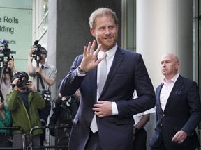 FILE - Prince Harry leaves the High Court after giving evidence in London, Wednesday, June 7, 2023. Prince Harry is seeking 320,000 pounds ($406,000) in his phone hacking lawsuit against Mirror Group Newspapers. The Duke of Sussex's lawyer submitted the claim in a court document Friday, June 30, 2023, at the conclusion of the trial that began in early May.