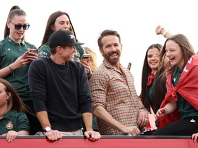 Ryan Reynolds and Rob McElhenney on Wrexham AFC Victory Bus May 2023 - Getty