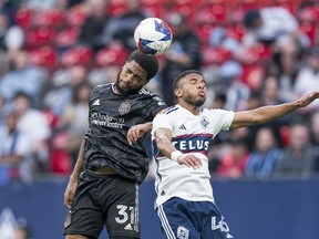 Vancouver Whitecaps FC's Pedro Vite, right, battles with Houston Dynamo FC's Micael battle for the ball during first half MLS soccer action in Vancouver, B.C., Wednesday, May 31, 2023.