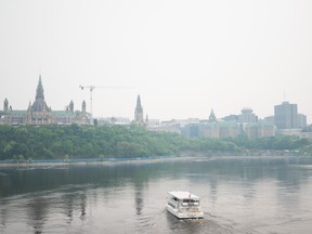 Downtown Ottawa is seen blanketed in smoke from wildfires on Monday, June 5, 2023. Raging wildfires and smoky skies across much of Canada have put a damper on travel and tourism plans this summer resulting in cancelled plans and closed businesses.