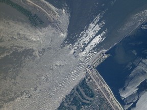This satellite image provided by Planet Labs PBC shows an overview of the damage on the Kakhovka dam in southern Ukraine on Tuesday, June 6, 2023. Ukraine accused Russian forces Tuesday of blowing up the Kakhovka dam and hydroelectric power station on the Dnieper River in an area that Moscow controls, while Russian officials blamed Ukrainian bombardment in the contested area. It was not possible to verify the claims. (Planet Labs PBC via AP)