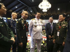 FILE - Indonesia's Adm. Yudo Margono, center, talks with Cambodia's Gen. Vong Pisen, second right, Thailand's Gen. Chalermphon Srisawasdi, third left, and Vietnam's senior Lt. Gen. Nguyen Tan Cuong, left, during the Association of Southeast Asian Nations (ASEAN) chiefs of defense forces meeting in Nusa Dua, Bali, Indonesia on June 7, 2023. Indonesia, the current chair of the Association of Southeast Asian Nations, said Tuesday, June 20, it was moving ahead with plans for joint naval exercises in September, the first-ever being held by the countries of the bloc on their own, which come at a time when several are taking stronger approaches to counter increasing Chinese assertiveness in the area.