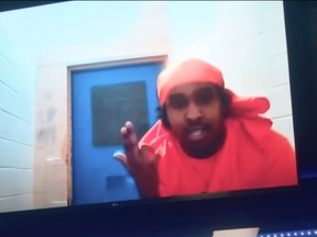 Hassan Ali, 23, appearing in his new music video in scenes apparently shot in his cell at Milton's Maplehurst Complex. Ontario's solicitor general is investigating