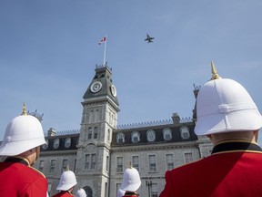 A F/18 jet from CFB Bagotville does a flyby during the graduation from the Royal Military College of Canada in Kingston, Ontario, on Friday May 20, 2022. The civilian members of the board tasked with reviewing Canada's military colleges will not include anyone who has expressed a strong opinion on their future, or anyone who attended one of the schools, according to a recruitment posting.THE CANADIAN PRESS/Lars Hagberg
