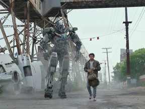 From left, Mirage and Anthony Ramos in Transformers: Rise of the Beasts.
