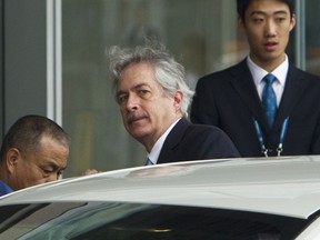 FILE - William Burns, center, enters a car after arriving at Capital International Airport in Beijing, May 1, 2012. A U.S. official says CIA Director William Burns went to Beijing in May to meet with Chinese counterparts. It's the highest level visit by a Biden administration official since a suspected Chinese spy balloon was shot down by American forces.