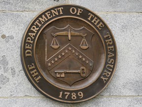 FILE - The Department of the Treasury's seal outside the Treasury Department building in Washington on May 4, 2021. The U.S. sanctioned a group of Russian-intelligence linked individuals Monday for their role in allegedly helping the Kremlin destabilize Moldova's democratically-elected government through protests in Moldova's capitol earlier this year.