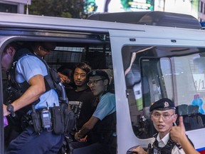 Activist Leo Tang is taken away by police near Victoria Park, the city's venue for the annual 1989 Tiananmen massacre vigil, on the 34th anniversary of China's Tiananmen Square crackdown in Hong Kong, Sunday, June 4 2023.