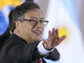 Colombia's President Gustavo Petro waves upon arrival for the South American Summit at Itamaraty palace in Brasilia, Brazil, Tuesday, May 30, 2023. South America's leaders are gathering as part of President Luiz Inácio Lula da Silva's attempt to reinvigorate regional integration efforts.