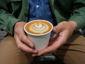 Wallace Espresso founder and owner Daniel Wahlen at his King Street West location with an oat milk cappuccino, Wednesday May 19, 2021.