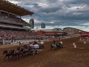 Chuckwagon races during the evening show at the Calgary Stampede Grandstand on Saturday, July 9, 2022.