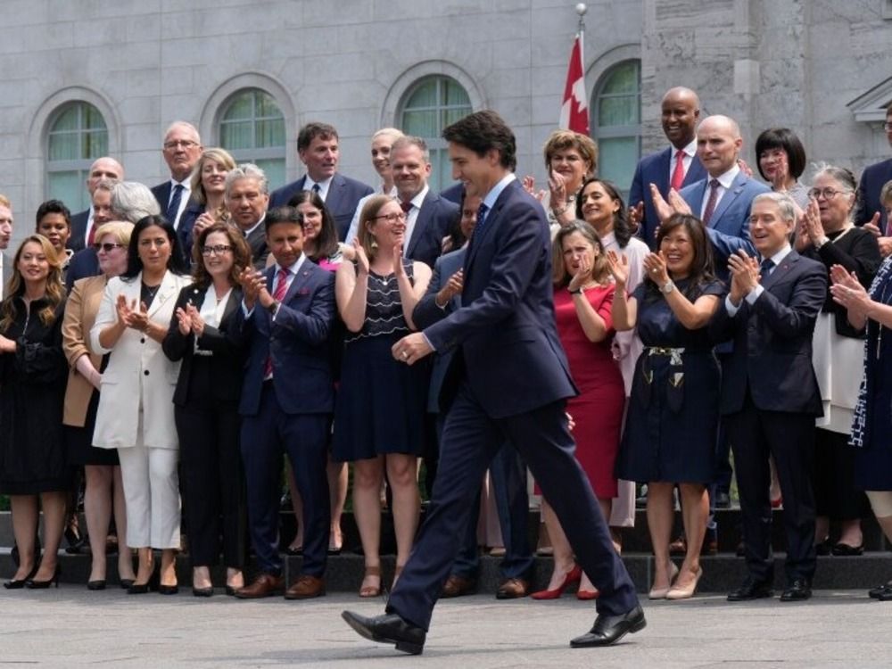 Prime Minister Justin Trudeau walks to a group photo opportunity with his new cabinet following a swearing-in ceremony at Rideau Hall in Ottawa on Wednesday, July 26, 2023.