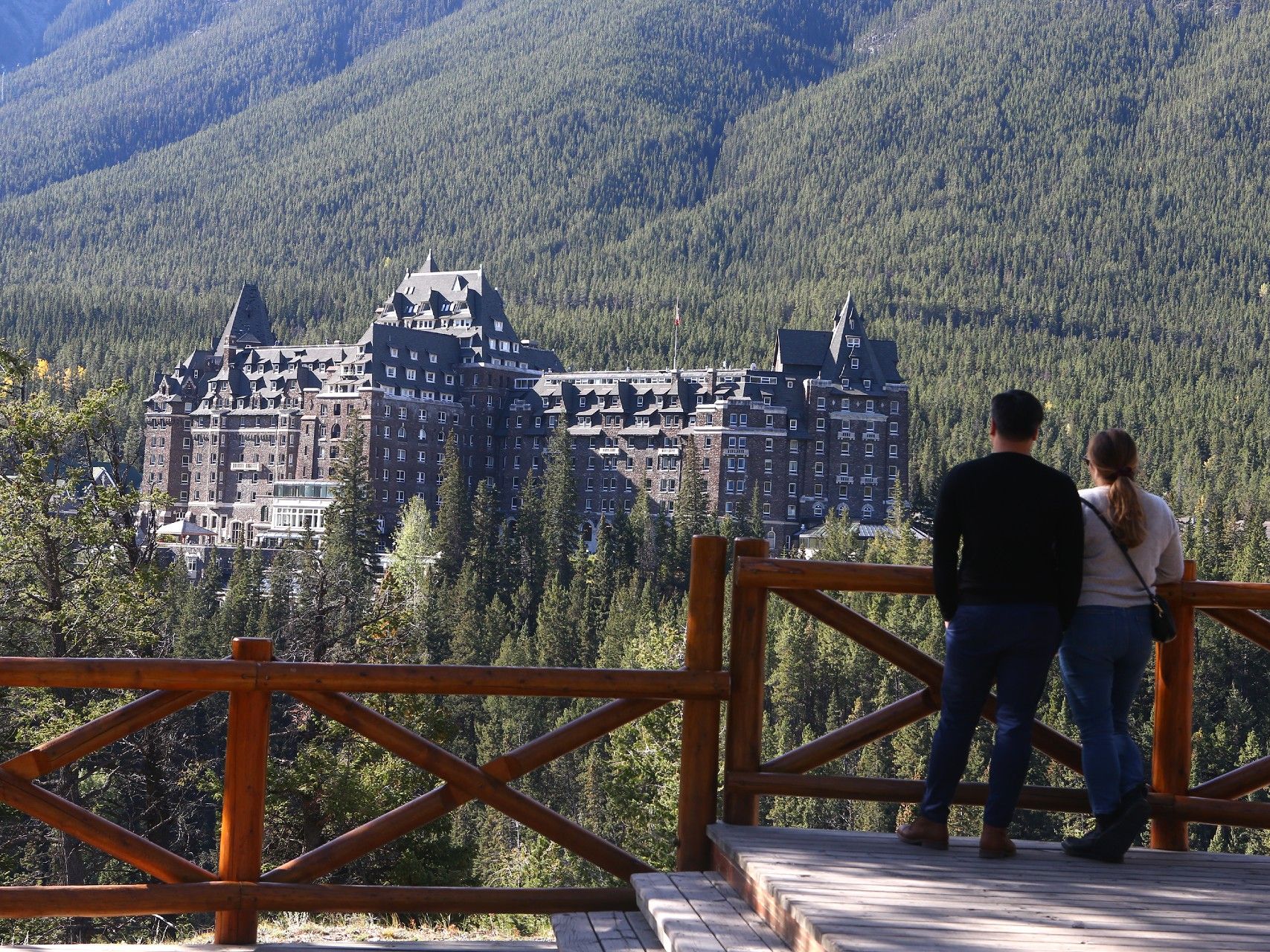 Tourists overlook the Fairmont Banff Springs Hotel