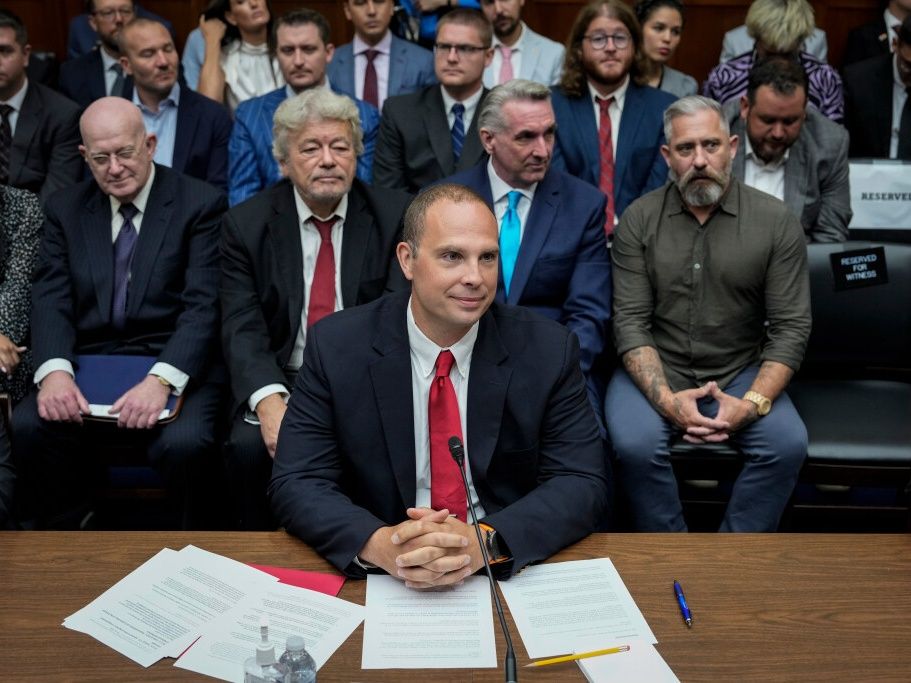 David Grusch, former National Reconnaissance Officer Representative of Unidentified Anomalous Phenomena Task Force at the U.S. Department of Defense, takes his seat as he arrives for a House Oversight Committee hearing titled "Unidentified Anomalous Phenomena: Implications on National Security, Public Safety, and Government Transparency" on Capitol Hill 26, 2023 in Washington, DC