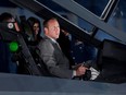 Peter MacKay checks out the cockpit of the F-35 Joint Strike Fighter following an announcement in Ottawa in 2010