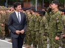 Prime Minister Justin Trudeau inspects Canadian troops at a military base in Adazi, Latvia, on July 10, 2023.