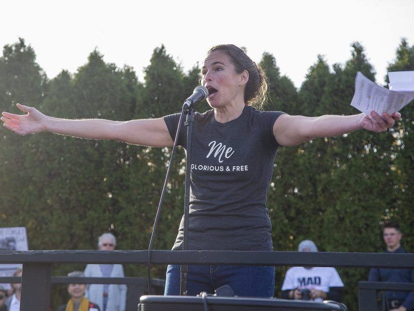 Kimberly Neudorf address a crowd of 2,000 people at the East Elgin Community Centre in Aylmer during a protest against COVID-19 public health measures on Nov. 7, 2020. (Derek Ruttan/The London Free Press)