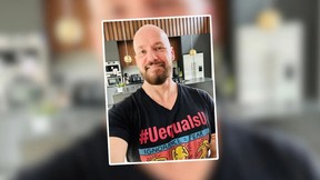 A man with a shaved head anf full beard smiles for the camera. Randy was diagnosed with HIV and had to deal with the stigma associated with the condition.