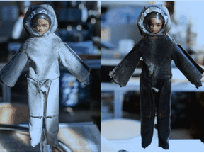 Barbie doll in spacesuit, covered with simulated moon dust.