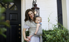 Woman holding baby in a Boba Wrap Baby Carrier