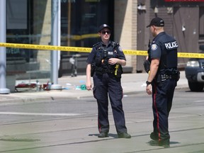 Police at the scene of a fatal shooting in Toronto.