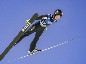 Canada's world champion ski jumper Alex Loutitt claimed a second bronze medal in as many days in the Grand Prix Summer Series.&ampnbsp;Loutitt flies through the air during the RAW AIR women's ski jumping HS 124 during the Holmenkollen Ski Festival, Oslo, Norway, Saturday March 11, 2023.