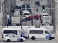 Police and rescue teams are pictured outside the metro station Maelbeek after an incident, in Brussels on Tuesday, March 22, 2016.