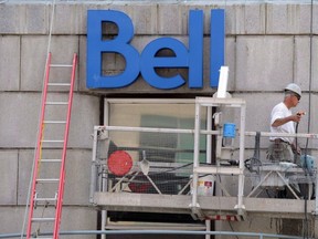 A construction worker works on a Bell building