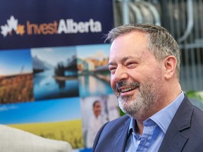 Former Alberta premier Jason Kenney, a senior advisor for tech company Eventcombo talks with guests during the announcement of Eventcombo's move to set up offices in Calgary on July 5.