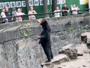 In videos shared on Chinese social media, Angela, a sun bear living in Hangzhou Zoo, was observed standing erect on a rock, her posture notably upright with a straight waist.