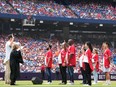 New Canadians take part in a Canada Day citizenship ceremony.