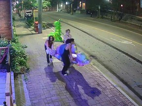 A video tweeted by the Chinatown BIA shows three women vandalizing and making off with the a purple dinosaur statue early Friday morning.