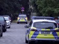 Police patrol during a search operation for a dangerous wild animal near the village of Kleinmachnow in the southern suburbs of Berlin, Germany, Thursday, July 20, 2023.