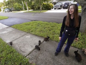 Florida resident Alicia Griggs with rabbits