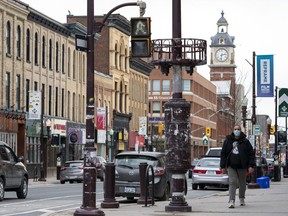A man walks in downtown Peterborough, Ont.