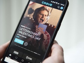 The Crave app is seen on a phone in Toronto on Thursday, Feb. 7, 2019. Crave is introducing two ad-supported tiers that each shave $5 or $10 off the monthly subscription fee.