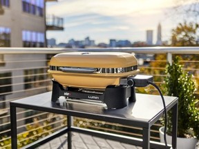 Lumin Compact Electric Grill in Golden Yellow.