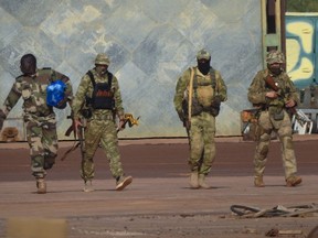 FILE - This undated photograph provided by the French military shows three Russian mercenaries, in northern Mali. On July 27-28, 2023 Russian President Vladimir Putin is hosting delegations from almost all of Africa's 54 countries at the second Russia-Africa Summit. (French Army via AP, File)
