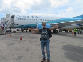 Stephen Fenech in front of Nauru Airlines plane