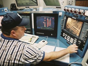 FILE - Control room supervisor Lance Pappas consults a video monitor inside the Umatilla Chemical Agent Disposal Facility, June 8, 2004, outside Hermiston, Ore.