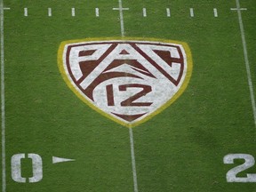 FILE - The Pac-12 logo is shown at Sun Devil Stadium during the second half of an NCAA college football game between Arizona State and Kent State in Tempe, Ariz., Aug. 29, 2019. Colorado is leaving the Pac-12 to return to the conference the Buffaloes jilted a dozen years ago, and the Big 12 celebrated the reunion with a two-word statement released through Commissioner Brett Yomark: "They're back."