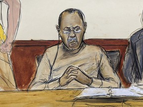 In this courtroom sketch Mozambique's former finance minister Manuel Chang, center, pleaded not guilty in a U.S. federal court, in New York, Thursday, July 13, 2023, in connection with a $2-billion corruption and money laundering scandal that prosecutors said defrauded American investors and threatened to further destabilize the economy of one of the world's poorest countries.