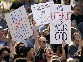 FILE - Abortion-rights protesters cheer at a rally, June 24, 2022, in Des Moines, Iowa. Iowa's Legislature convenes Tuesday, July 11, 2023, in a special session focused exclusively on abortion restrictions, where Republican lawmakers will work to push through a new ban on abortion after roughly six weeks of pregnancy.