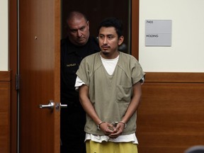 FILE - Gerson Fuentes, right, the man accused of raping and impregnating a 9-year-old Ohio girl, who at 10 had to travel to Indiana for an abortion, enters Franklin County common pleas court in Columbus, Ohio, for his bond hearing, July 28, 2022. On Wednesday, July 5, 2023, Fuentes pleaded guilty to two counts of rape. He was sentenced to life in prison but, as part of his plea deal, will be eligible to seek probation after serving 25 to 30 years. He will also have to register as a sex offender.