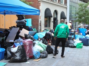 The plight of the African refugees who have come to Canada from nations like Uganda, Kenya, Nigeria continues outside the Peter St. city run facility for homeless. Advocacy groups arrived on Friday to get all levels of government to come together and help. on Thursday July 13, 2023.
