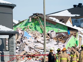 Damage is seen following an early morning gas leak explosion in the Orleans area of Ottawa, on Monday, Feb. 13, 2023. The man charged with causing an explosion that destroyed several new homes in Ottawa earlier this year is expected to plead guilty next month.